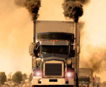 Diesel Semi Truck with smoke pouring from stacks