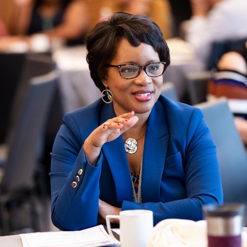 Metro CEO Stephanie Wiggins, seated in a blue business suit