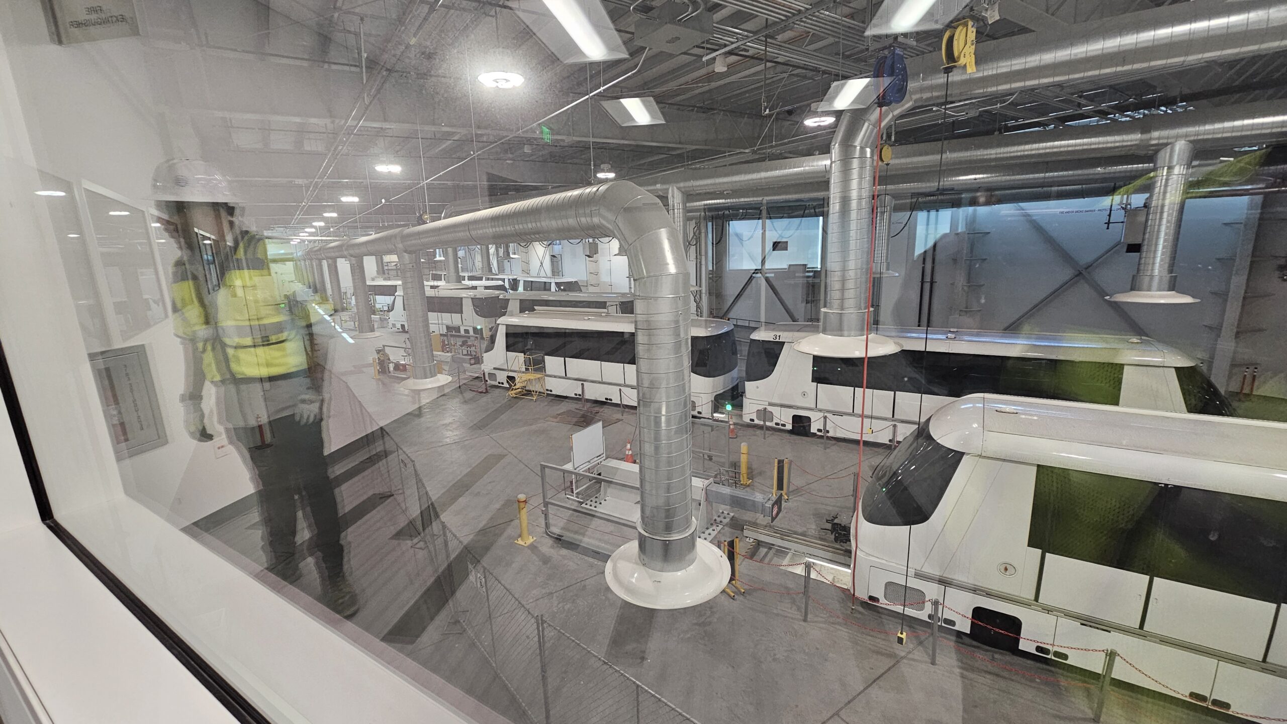 A man surveys the LAX People Mover through the observation window